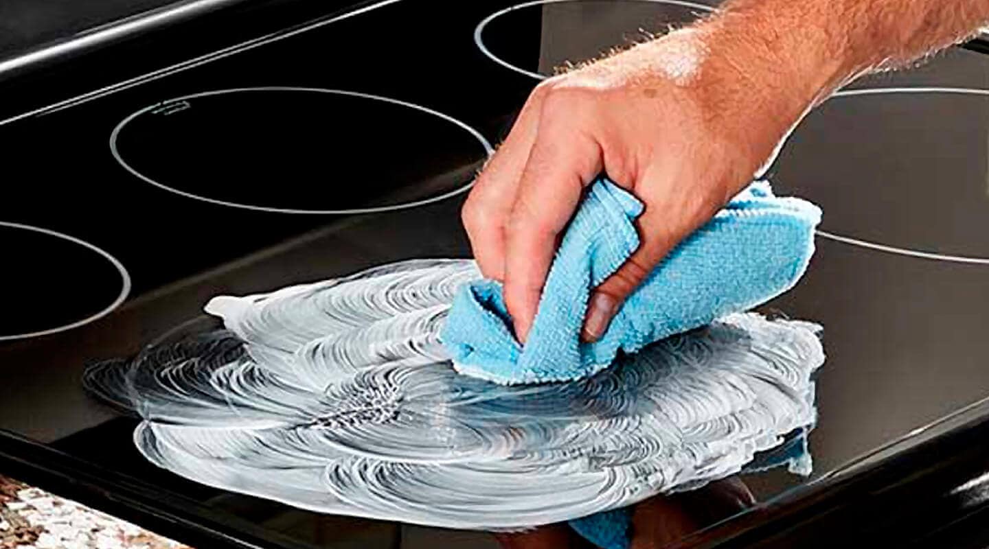 "Cleaning a best glass top stove with a microfiber cloth"