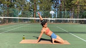 Man doing a full body calisthenics workout outdoors
